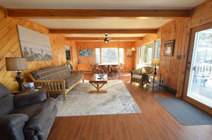 The living area has picture windows and a futon couch: perfect for admiring the view by day, and best suited for kiddos to sleep.