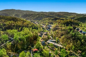 An aerial view of downtown Gatlinburg and the Smoky Mountains from above the cabin.