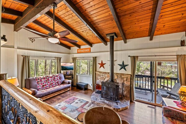 Spacious living area with a fireplace.