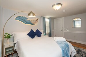  Spring Serenity Awaits! Relax in this beautifully designed bedroom, where a cozy queen bed and a soft, feather-inspired light create the perfect tranquil retreat.#SpringEscape #CozyNook