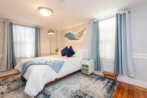 Relax in style with a plush queen bed in this beautifully designed bedroom. Ideal for unwinding after a day of adventure!