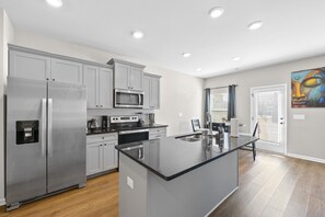 Stylish kitchen: sleek appliances, ample counter space, modern design