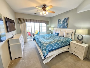 Master Bedroom with beautiful furnishings, king bed, and large mounted TV!