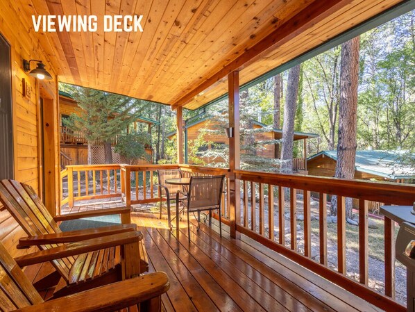 Relax on the cozy viewing deck at Bear's Creek, where you can soak in the peaceful forest surroundings. Enjoy your morning coffee or evening glass of wine just minutes from Ruidoso.