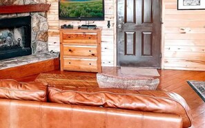 Unwind in the living area with a flat-screen TV equipped with Roku for streaming your favorite shows. Also, you’ll love the convenience of the remote-controlled fireplace for a cozy, effortles