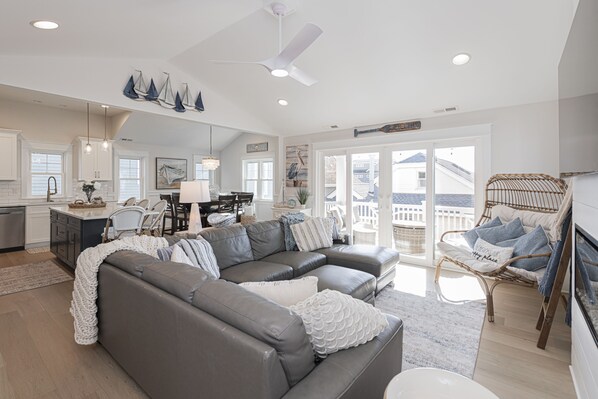Bright Coastal Living Room with Vaulted Ceilings