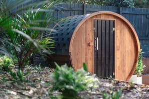 Unwind in the 3-4 person infra-red barrel sauna.