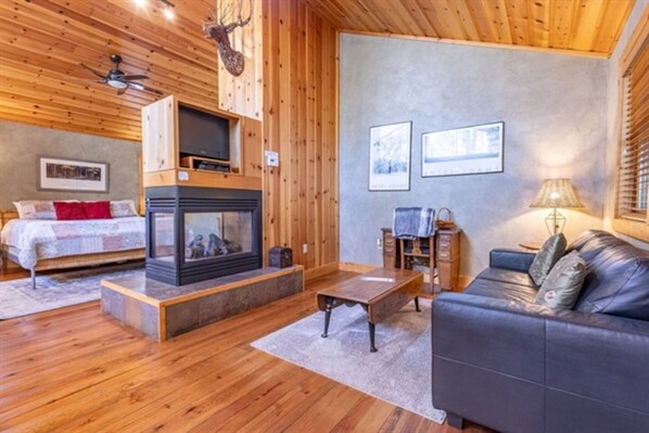 Relax in our impeccably clean and well-organized space, where the indoor fireplace adds warmth and charm to your cozy retreat, creating the perfect ambiance for relaxation and tranquility.