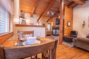Intimate dining awaits in this charming setting for two. Savor every moment together in this cozy dining nook designed for cherished conversations and shared meals.