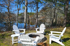 Fire pit on side Yard that overlooks the pond.  This yard is elevated from the water.