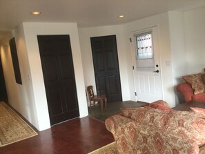 entry, coat closet, and powder room