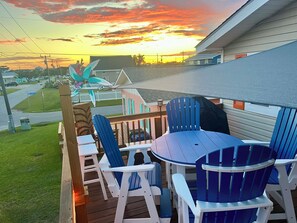 Massive elevated deck with outdoor dining, sectional with fire table and grill.