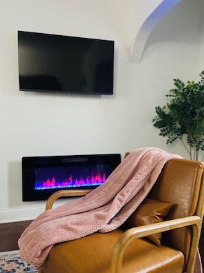Warm up next to kid safe fireplace.