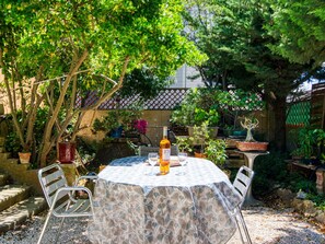Plant, Table, Furniture, Property, Chair, Leaf, Botany, Outdoor Table, Window, Outdoor Furniture