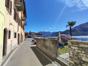 Sky, Water, Building, Cloud, Window, Azure, Mountain, Plant, Wood, House