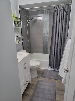 full bathroom with tub