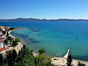 Water, Sky, Azure, Tree, Boat, Natural Landscape, Coastal And Oceanic Landforms, Building, Lake, Beach