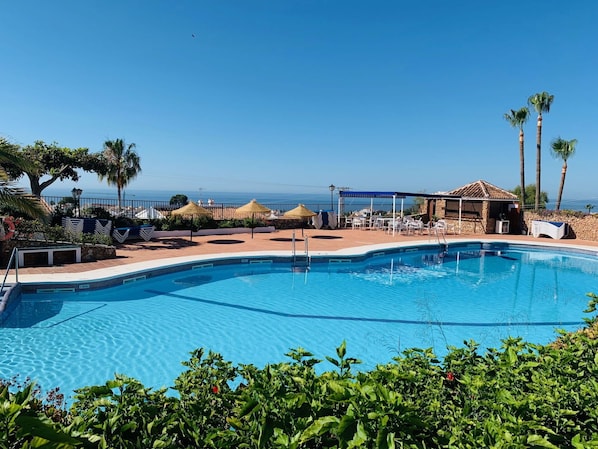Water, Sky, Plant, Swimming Pool, Azure, Tree, Shade, Outdoor Furniture, Building, Seaside Resort