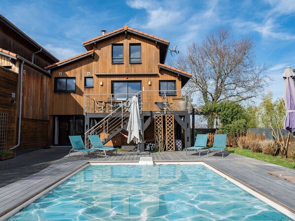 Sky, Water, Property, Chair, Shade, Wood, Interior Design, Body Of Water, Floor, Outdoor Furniture