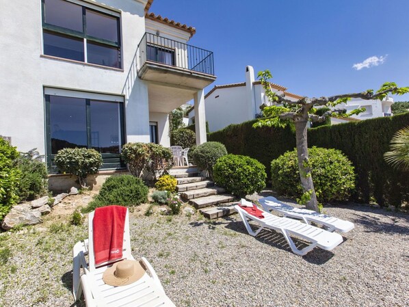 Plant, Property, Plant Community, Building, Window, Sky, Outdoor Furniture, Land Lot, Cottage, House