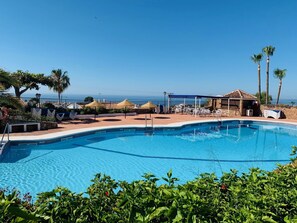Water, Sky, Plant, Swimming Pool, Azure, Tree, Shade, Outdoor Furniture, Building, Seaside Resort