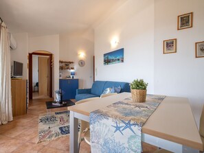 Picture Frame, Azure, Wood, Comfort, Flooring, Floor, Living Room, Table, Houseplant, Real Estate