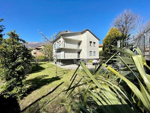 Sky, Plant, Building, Window, House, Natural Landscape, Tree, Land Lot, Slope, Grass