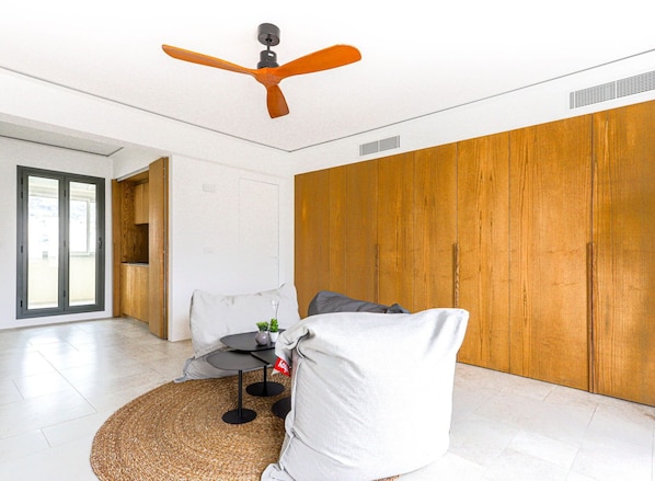 Furniture, Building, Ceiling Fan, Wood, Window, Comfort, Interior Design, Orange, Lighting, Flooring