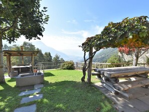 Plant, Cloud, Sky, Property, Natural Landscape, Shade, Land Lot, Body Of Water, Grass, Outdoor Furniture