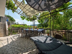 Plant, Sky, Property, Furniture, Table, Shade, Chair, Interior Design, Outdoor Furniture, Flowerpot