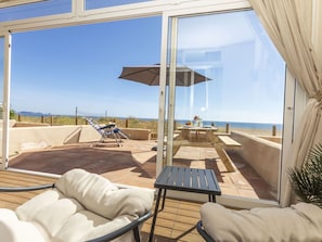 Furniture, Floor, Chair, Shade, Balcony, Hardwood, Outdoor Furniture, Wood Stain, Wood Flooring, Resort