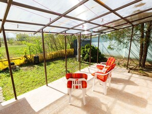 Plant, Shade, Chair, Outdoor Furniture, Table, Interior Design, Building, Leisure, Tree, Real Estate