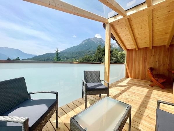 Sky, Furniture, Property, Water, Building, Shade, Table, Interior Design, Outdoor Furniture, Cloud