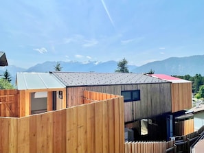 Sky, Cloud, Wood, Tree, Real Estate, Roof, Facade, Landscape, Slope, Siding
