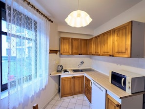 Cabinetry, Countertop, Property, Kitchen, Window, Drawer, Interior Design, Lighting, Wood, Sink