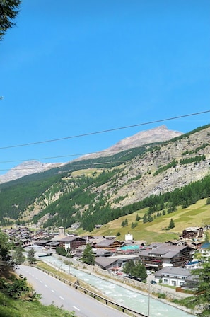 Sky, Plant, Mountain, Daytime, Slope, Highland, Natural Landscape, Road Surface, Landscape, Mountainous Landforms