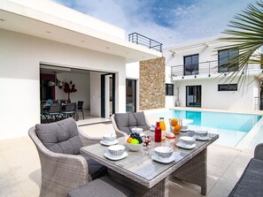 Sky, Building, Table, Window, Outdoor Furniture, Urban Design, Wood, Shade, Condominium, House