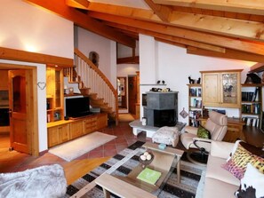 Building, Wood, Television, Picture Frame, Couch, Floor, Flooring, Living Room, Hardwood, Real Estate
