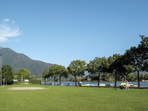 Sky, Plant, Cloud, Water, Tree, Natural Landscape, Mountain, Land Lot, Grass, Bank