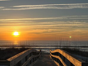 Stroll to the beach for a sunrise view and catch surfers riding the waves.