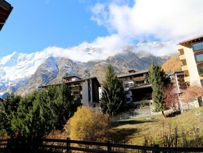 Sky, Cloud, Plant, Building, Mountain, Property, Leaf, Nature, Highland, Natural Landscape