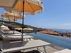 Sky, Water, Building, Umbrella, Azure, Table, Shade, Outdoor Furniture, Wood, Seaside Resort