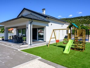 Sky, Building, Shade, Plant, Window, Door, Land Lot, Cloud, Tree, House