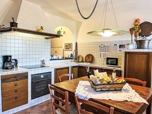Interior Design, Furniture, Kitchen, Flooring, Countertop, Ceiling, Room, Kitchen Appliance, Cabinetry, Lighting
