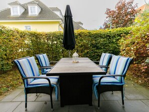 Plant, Table, Furniture, Property, Chair, Shade, Building, Outdoor Furniture, Outdoor Table, Grass