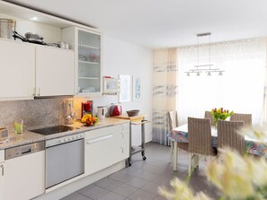 Furniture, Kitchen, Countertop, Interior Design, Kitchen Appliance, Cabinetry, Flooring, Major Appliance, Floor, Room