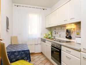 Cabinetry, Countertop, Property, Building, Kitchen Stove, Sink, Kitchen Appliance, Kitchen, Wood, Flooring