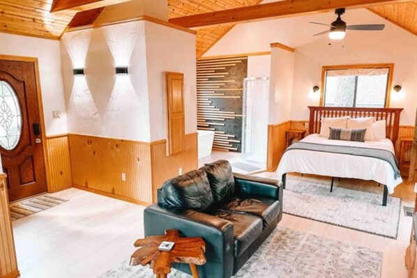 Spacious comfort: Bedroom seamlessly blends into inviting living area.