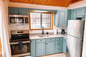 Modern convenience meets culinary delight: Fully-equipped kitchen with all the essentials for your cooking adventures.