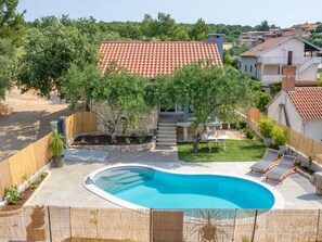 Water, Plant, Building, Property, Swimming Pool, Sky, Window, Azure, Outdoor Furniture, Tree